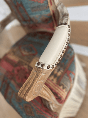 Trailblazer arm detail close up of leather arm detail photo of the trailblazer, a southwestern style chair with creme leather fringe