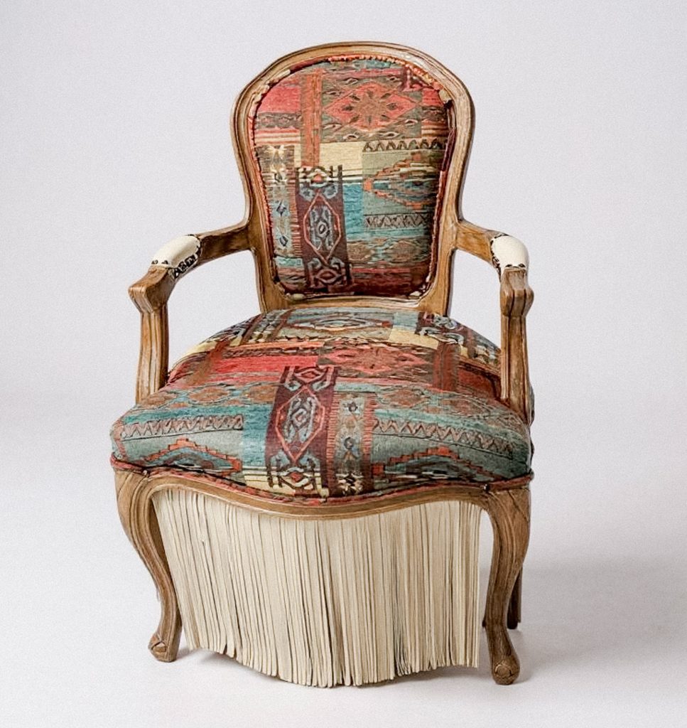 Full view of Trailblazer chair with vintage French frame and bold upholstery