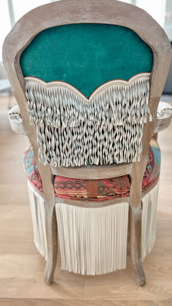 Rear view showing turquoise embossed leather and twisted fringe