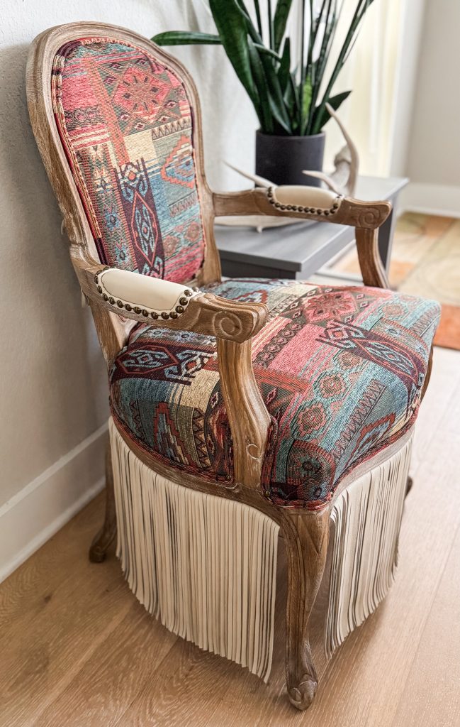 Trailblazer chair with fringe in a cozy neutral-toned room