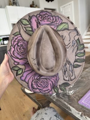 hand burned hat hand burned wide brim hat featuring cow skull with horns and hand painted pink and purple roses.