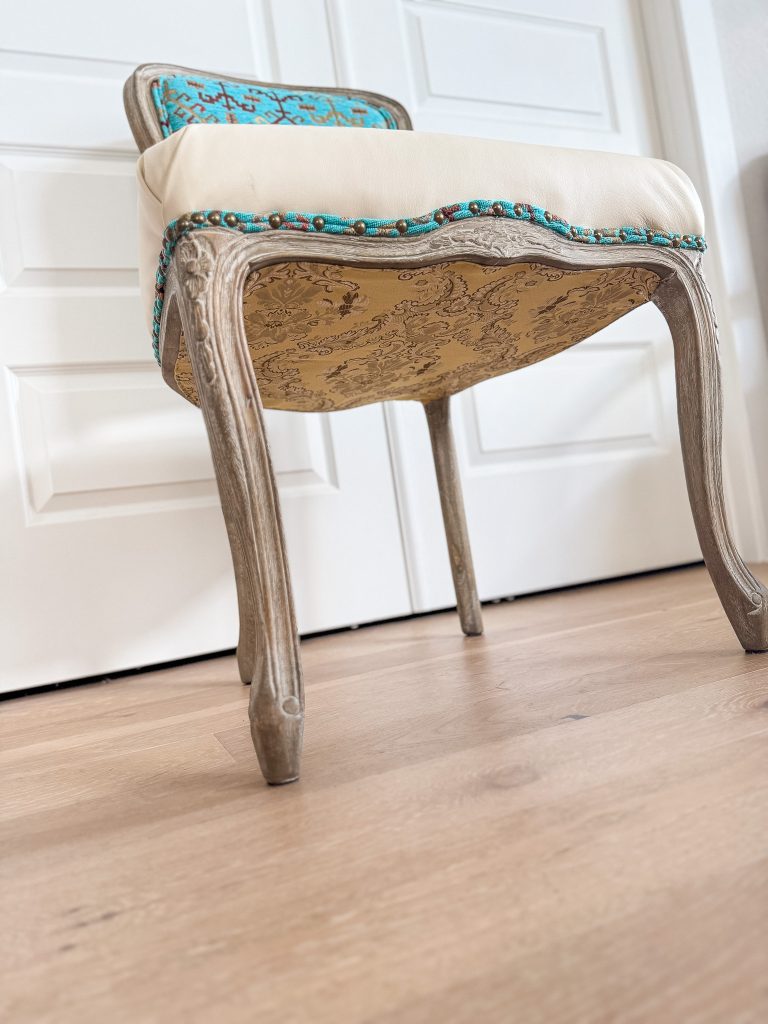 Southwestern style accent chair with cream leather seat and turquoise geometric textile back