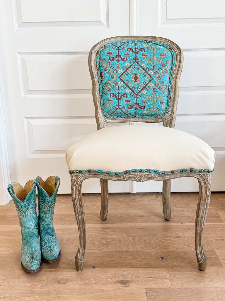 Southwestern style accent chair with cream leather seat and turquoise geometric textile back