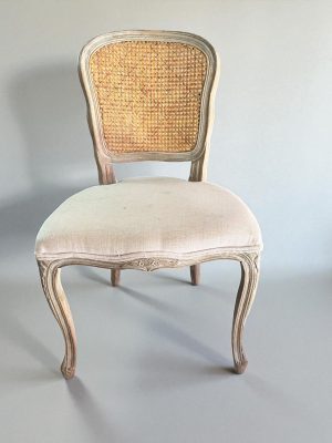 cane back accent chair available for customization. Armless accent chair with vintage carved frame and weathered wood.